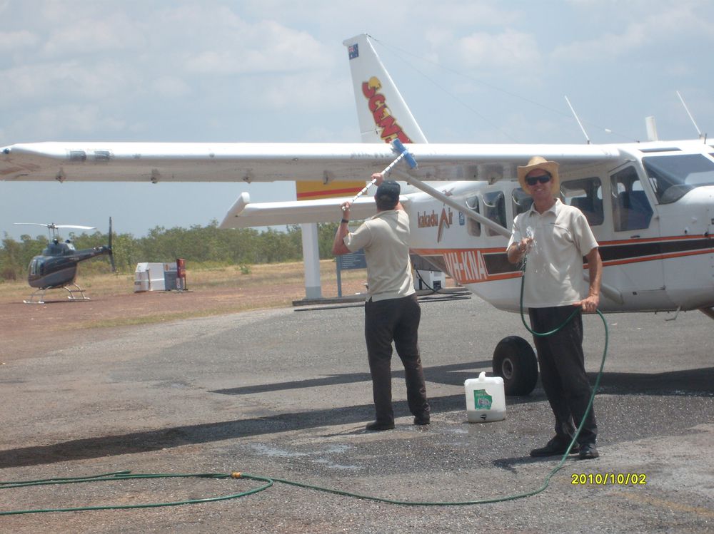 Wade and Andrew washing one of the planes in 38 degree heat (and me laughing at them)