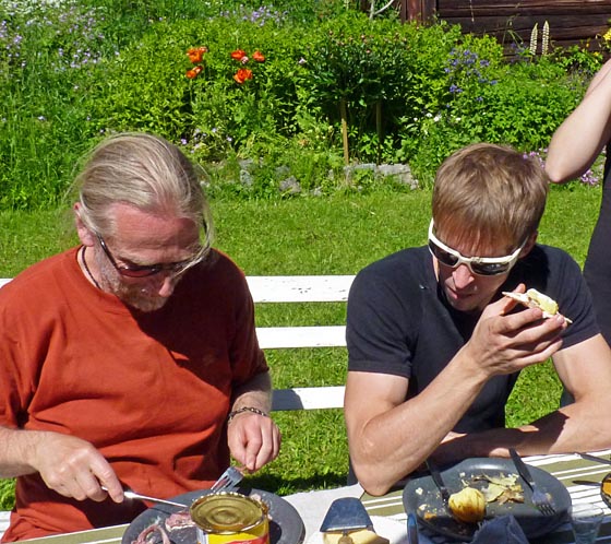 Jan teaching Adam how to eat fermented herring